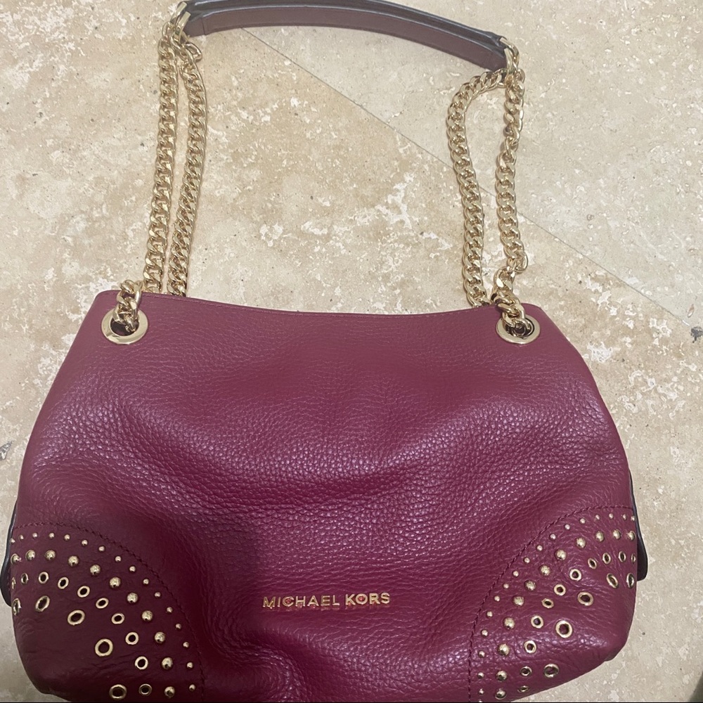 Burgundy Michael Kors purse with gold hardware